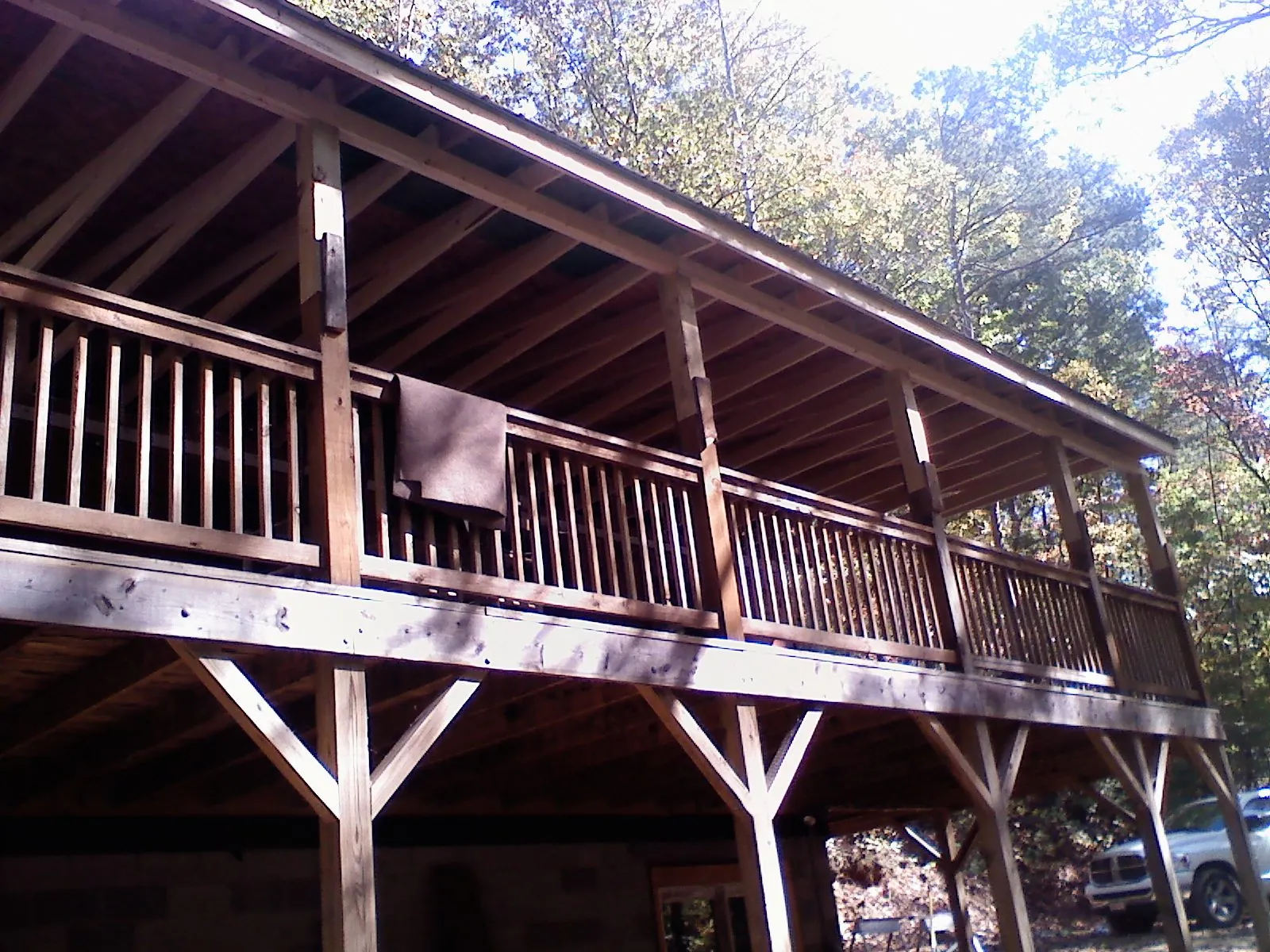 Timber framing under a new elevated porch and deck — Roof Leak Repair in New Hudson by Roofing Brothers